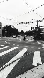 Road by city against sky