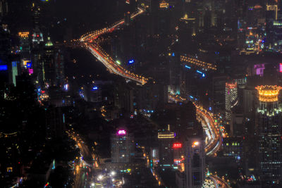 High angle view of illuminated city buildings at night