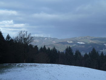 Scenic view of landscape against sky during winter