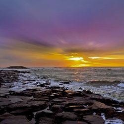 Scenic view of sea at sunset