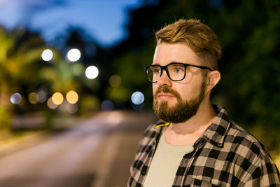 Portrait of young man looking away