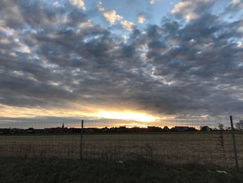 Scenic view of dramatic sky over landscape