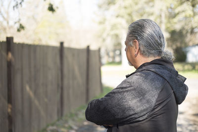 Rear view of man standing outdoors