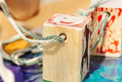 Close-up of rope tied up on table