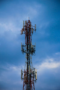 Low angle view of communications tower against sky