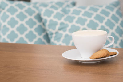 Close-up of coffee cup on table