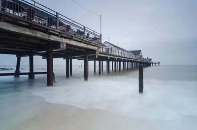 Pier over sea against sky