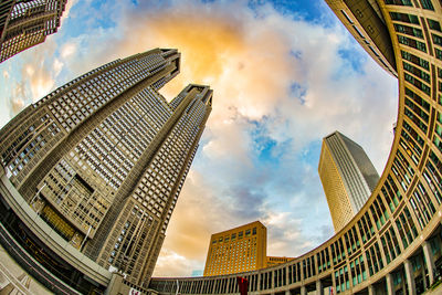 Low angle view of buildings against sky in city