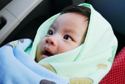 Close-up of cute baby in car