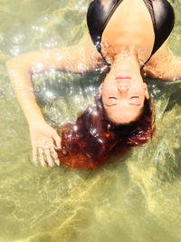 Portrait of young woman in swimming pool