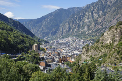 High angle view of townscape and mountains against sky