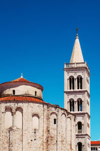 Low angle view of building against blue sky