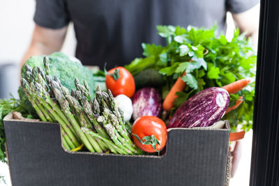 Vegetables and tomatoes on cutting board