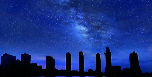 Low angle view of illuminated building against clear sky