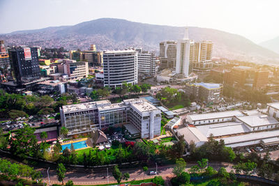 High angle view of buildings in city against clear sky