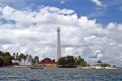 View of lighthouse against cloudy sky