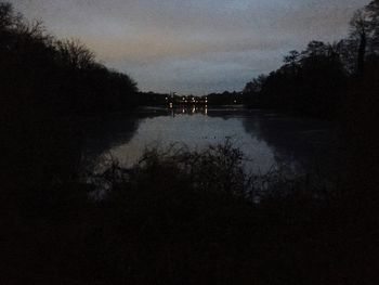 Scenic view of lake at sunset