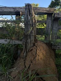 Close-up of old wooden fence on field