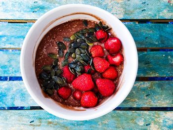 High angle view of strawberries in bowl on table