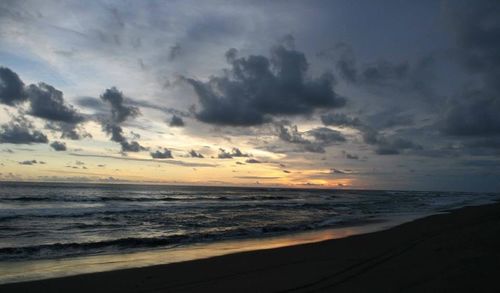 Scenic view of sea against cloudy sky