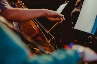 Midsection of man playing piano