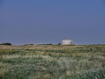 Scenic view of land against clear sky