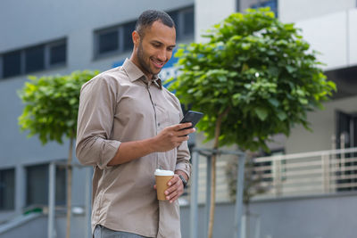 Young man using mobile phone