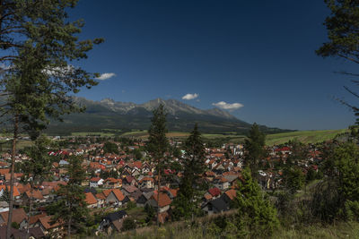 Houses in town against sky