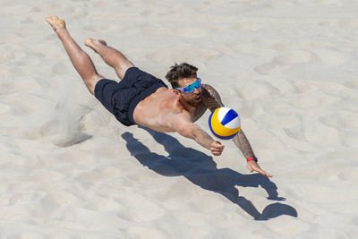 High angle view of person playing soccer on beach