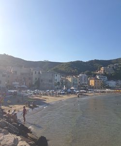 Scenic view of town against clear sky