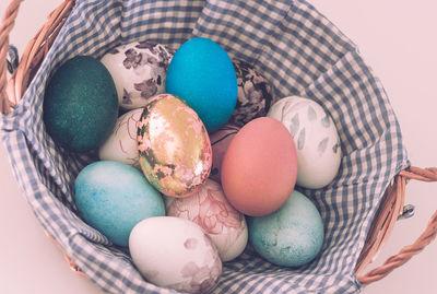 High angle view of eggs in basket on table