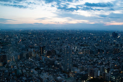 Aerial view of city buildings against sky