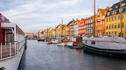 Boats in river in city