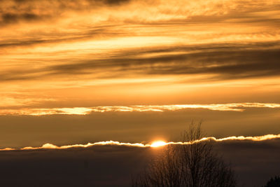 Scenic view of dramatic sky during sunset