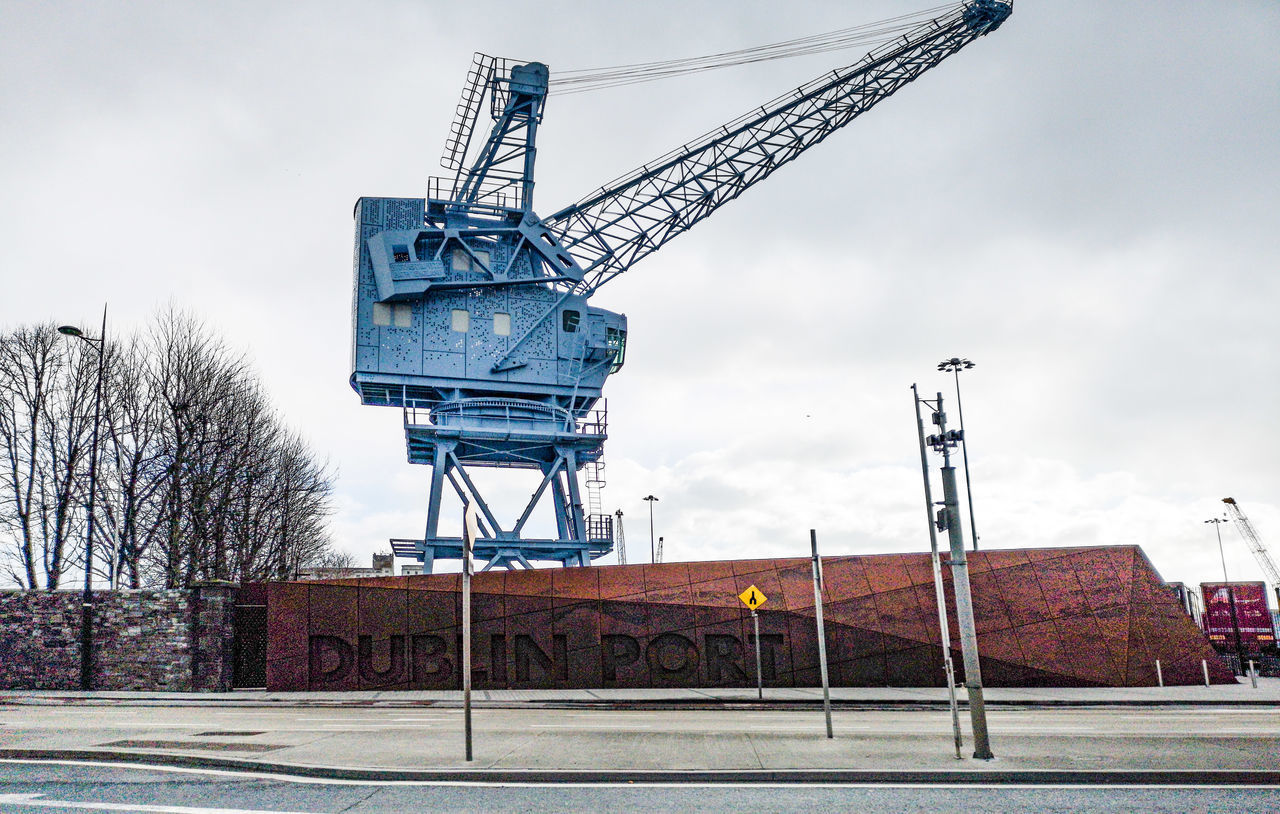 LOW ANGLE VIEW OF CRANE AT CONSTRUCTION SITE