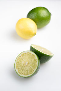 Close-up of fruits against white background