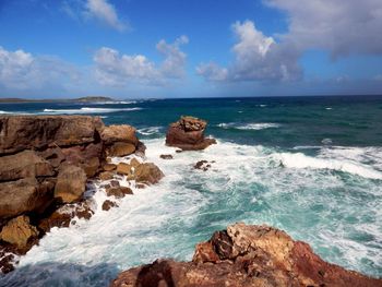 Scenic view of sea against blue sky