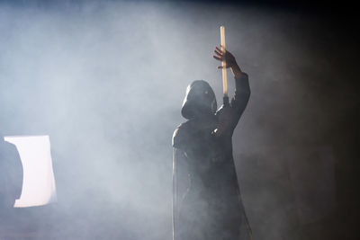 Low angle view of person standing against sky