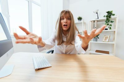 Portrait of young businesswoman working at office