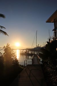 Silhouette bridge against sky during sunset