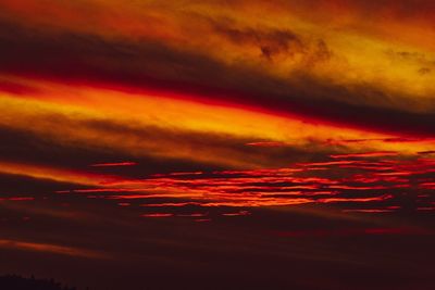 Low angle view of dramatic sky during sunset