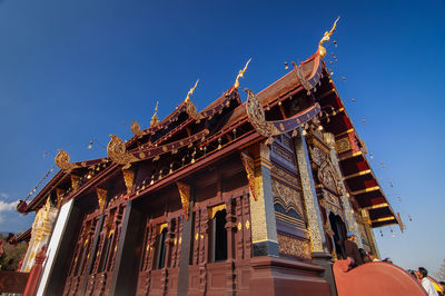 Low angle view of temple against building