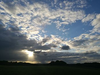 Scenic view of landscape against cloudy sky