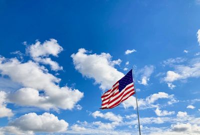 Low angle view of flag against sky