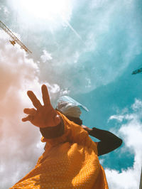 Low angle view of person against sky