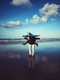 Woman jumping on beach