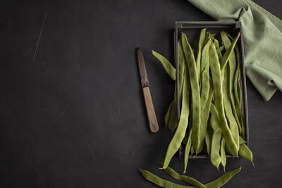 High angle view of vegetables on table against black background