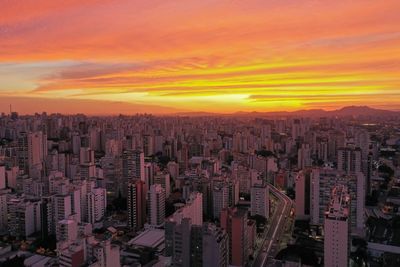 High angle view of buildings against sky during sunset