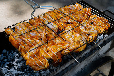 Close-up of meat on barbecue grill