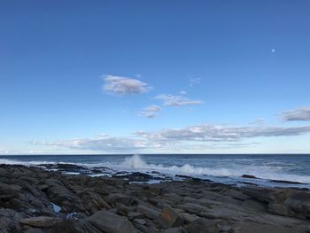 Scenic view of sea against blue sky